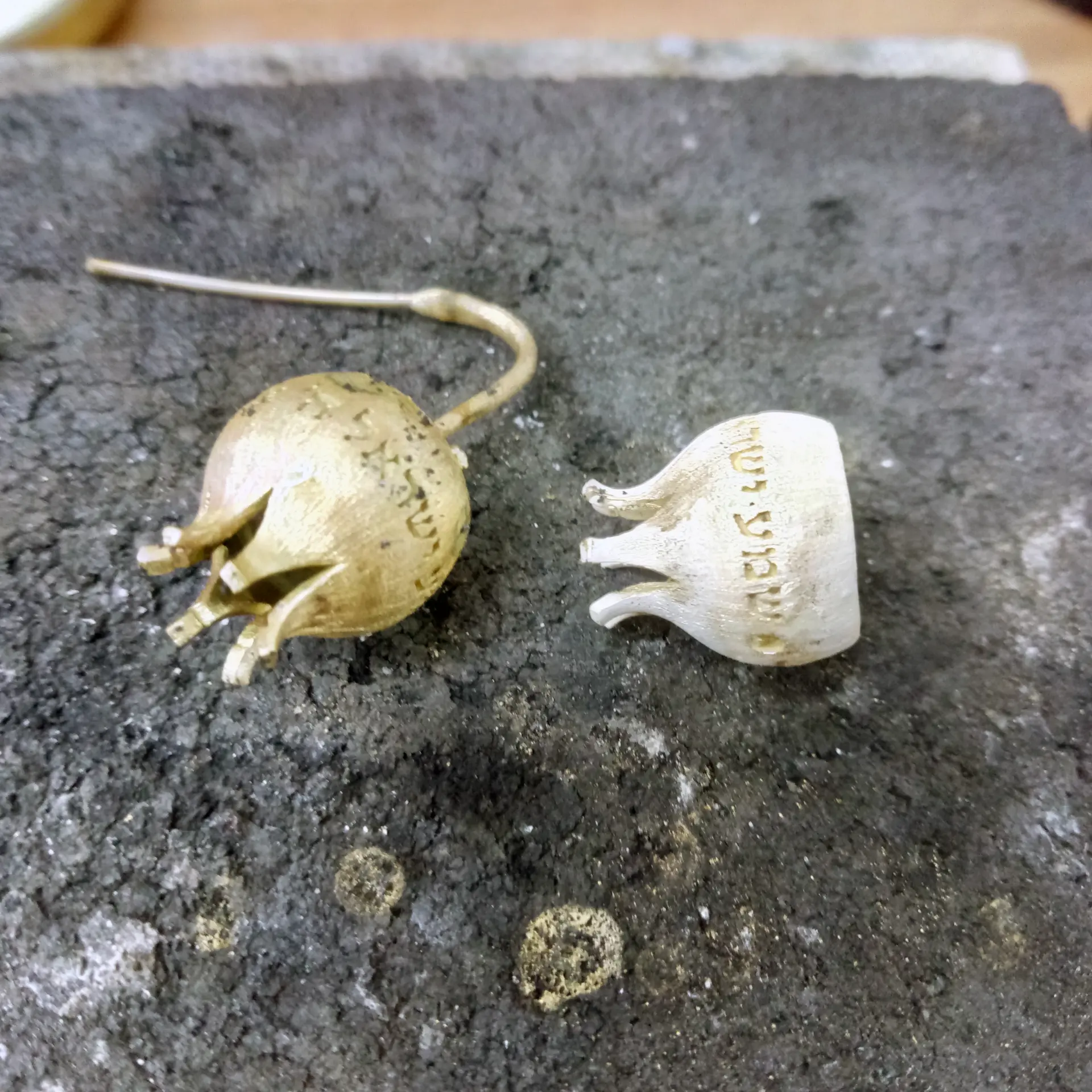Freshly cast gold components on the soldering block