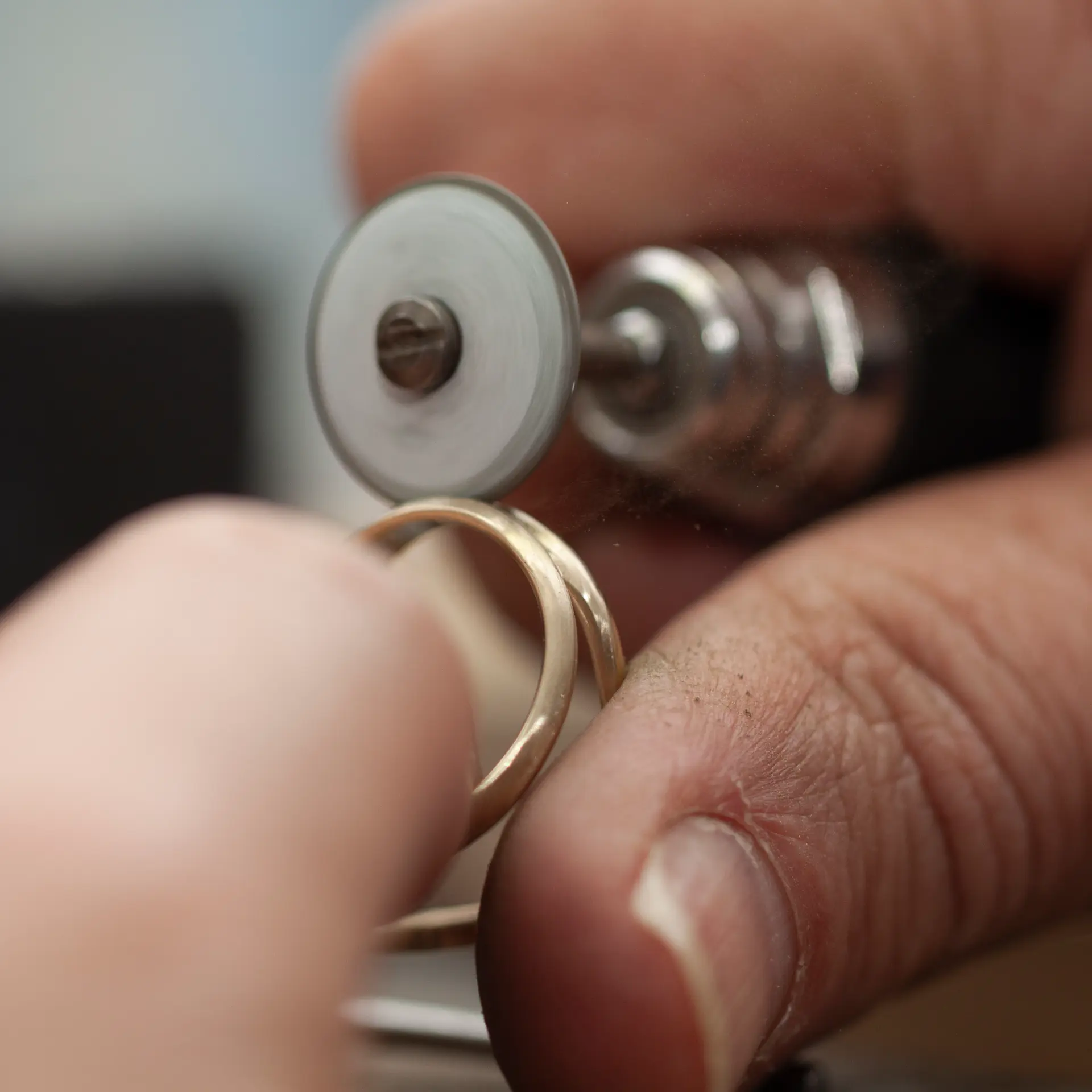 Polishing a gold band by hand